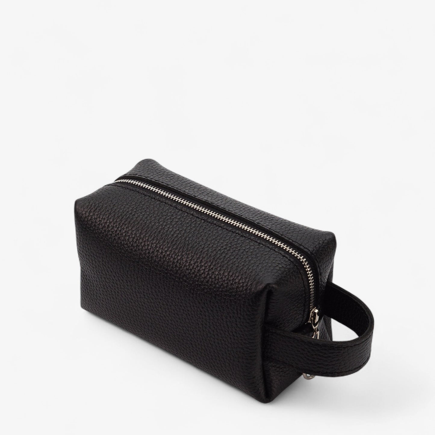 Black textured toiletry bag with a zipper on a white background