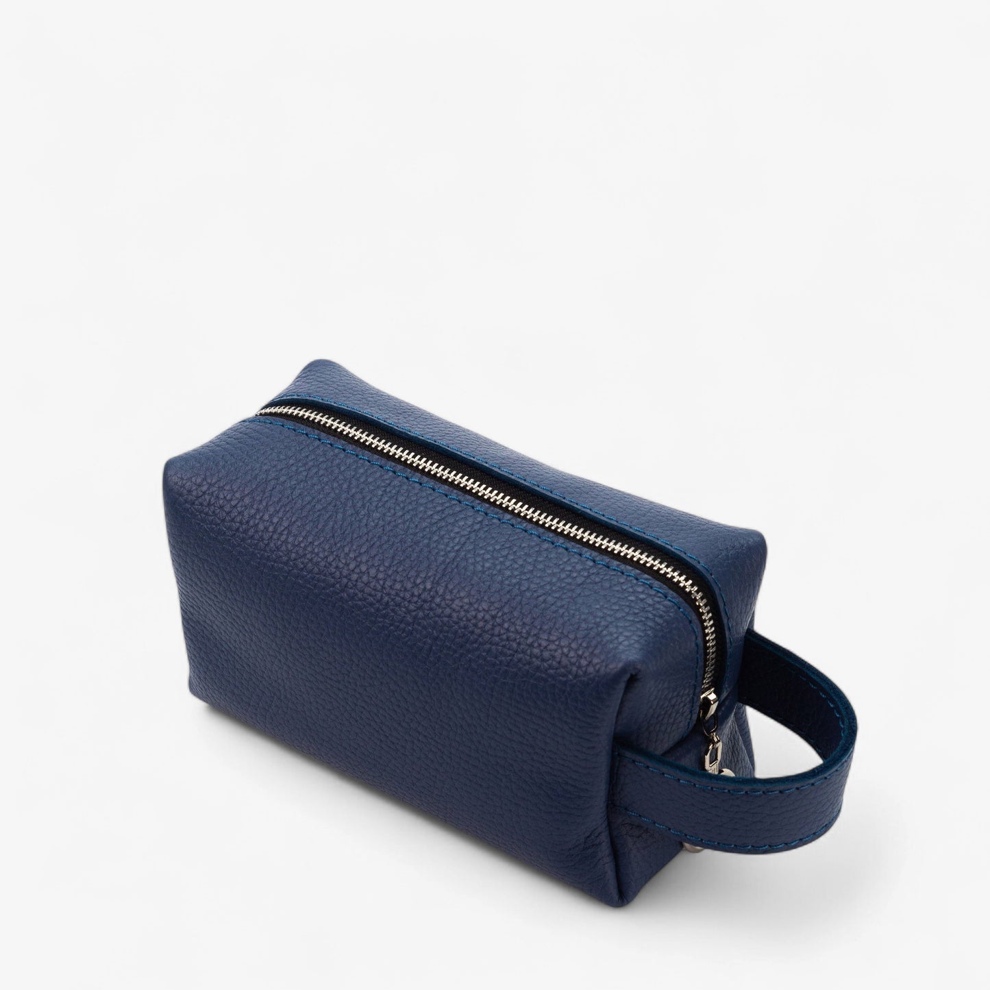 Blue toiletry bag with a zipper on a white background