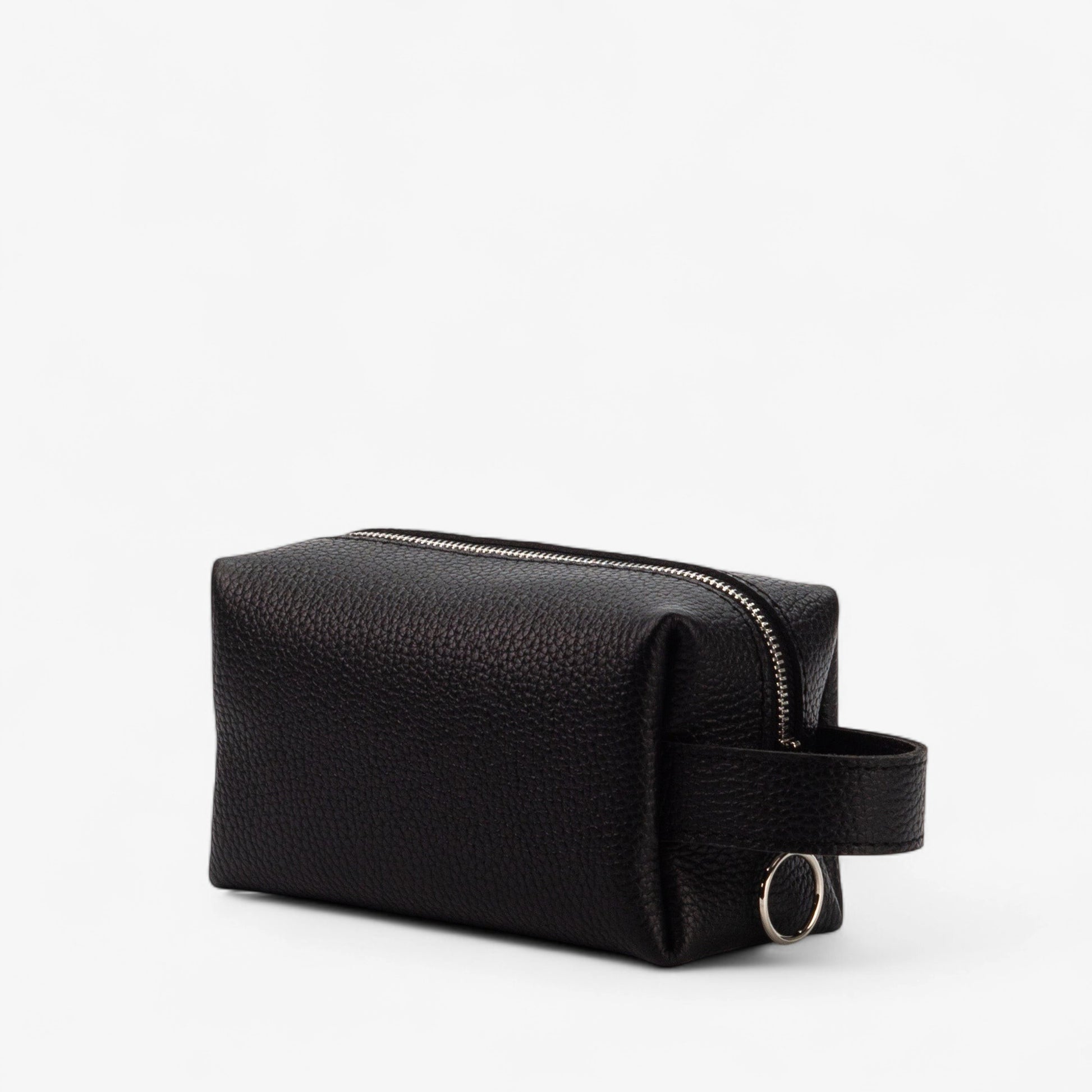 Black leather toiletry bag with a handle on a white background