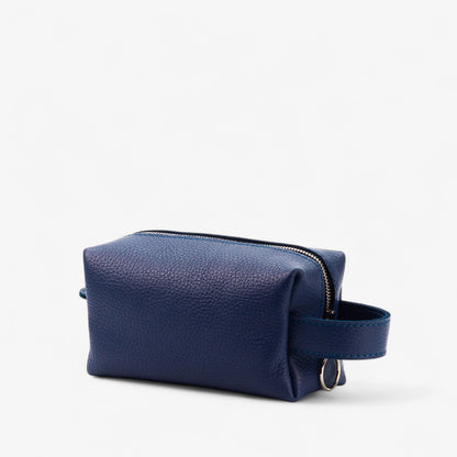 Navy blue leather toiletry bag on a white background