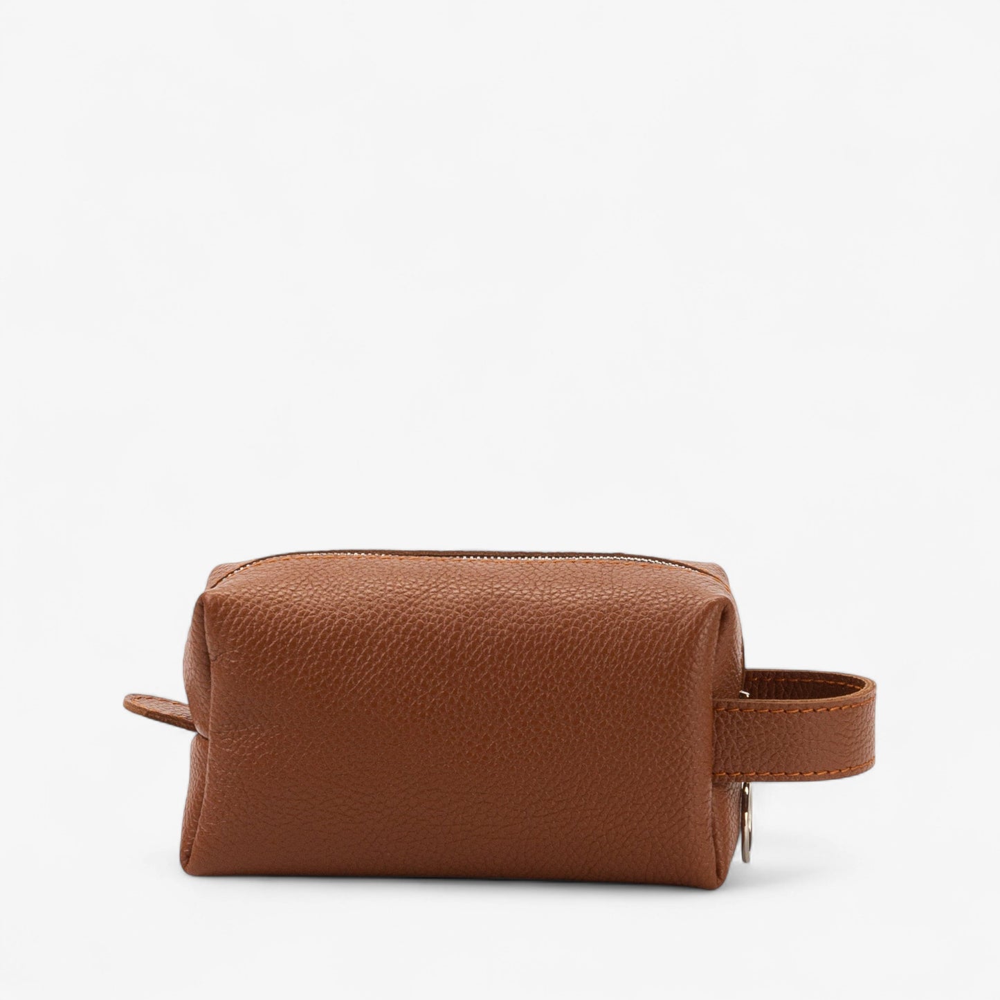 Brown leather toiletry bag on a white background