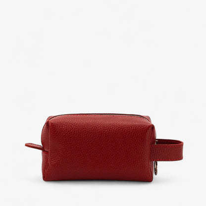 Red leather toiletry bag on a white background