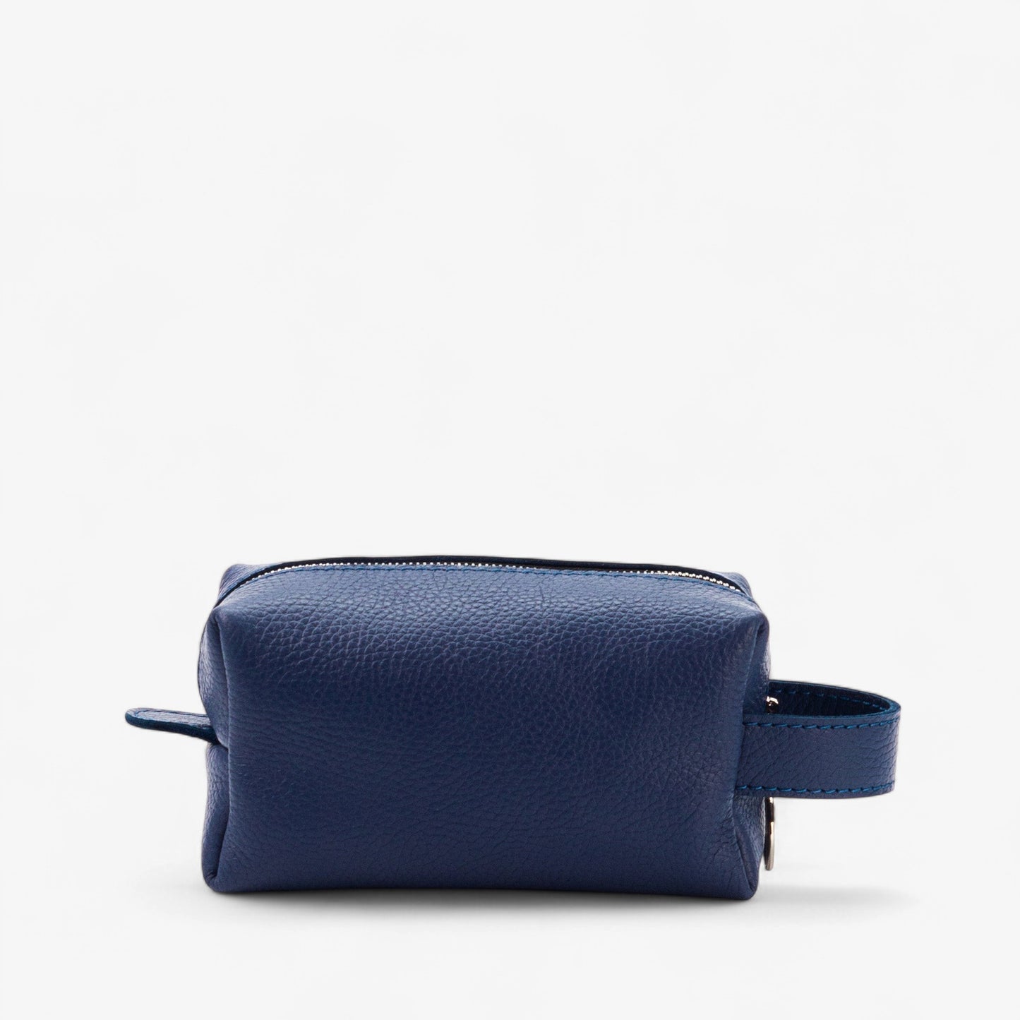 Blue leather toiletry bag on a white background