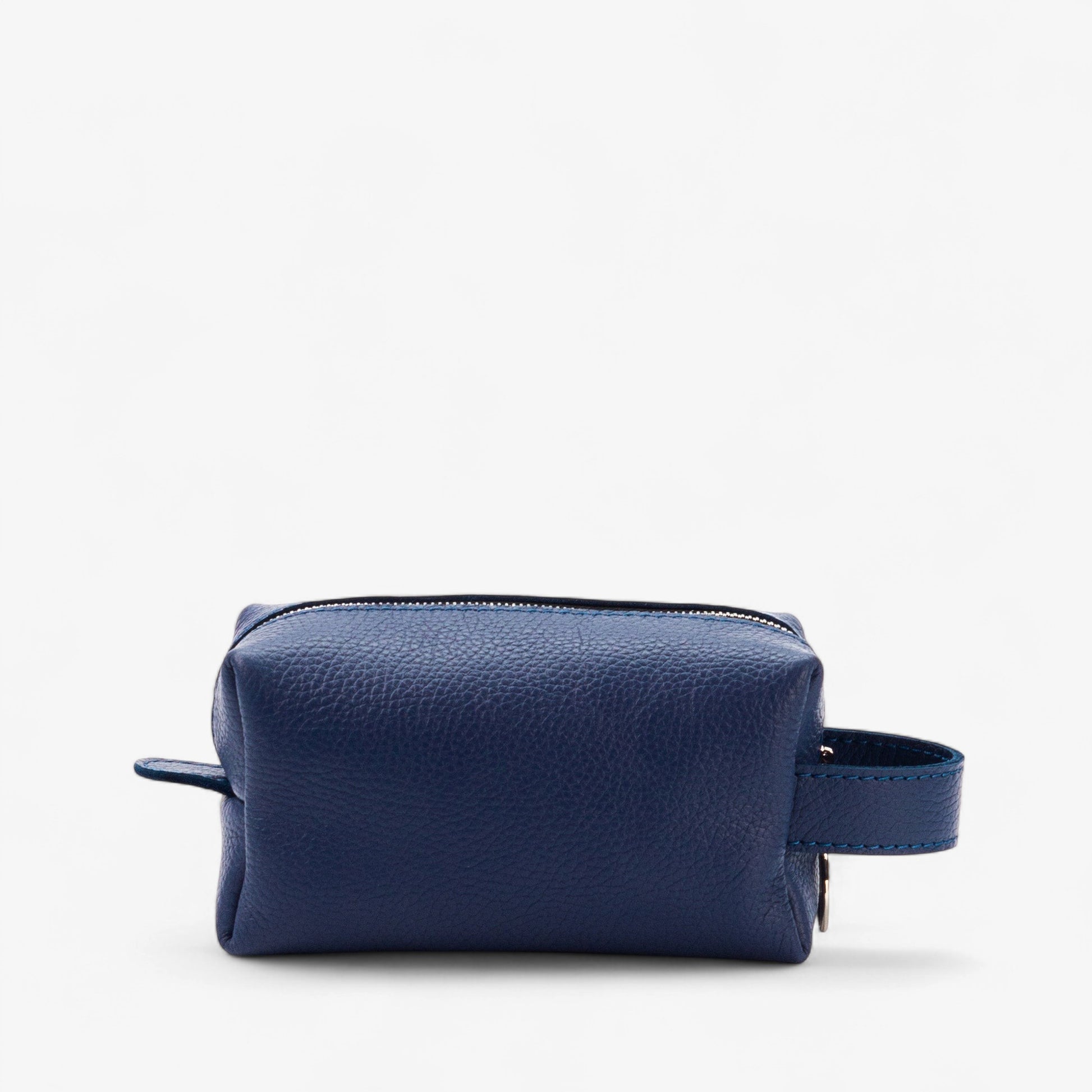 Blue leather toiletry bag on a white background
