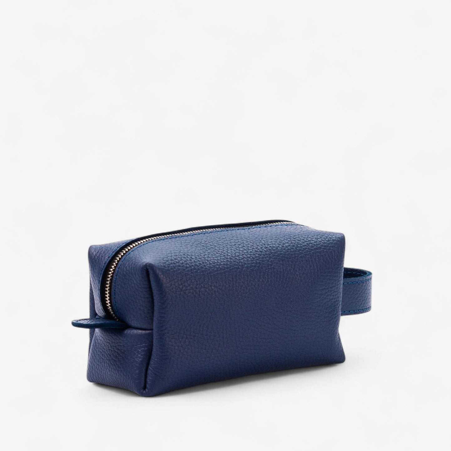 Blue leather toiletry bag with a zipper on a white background