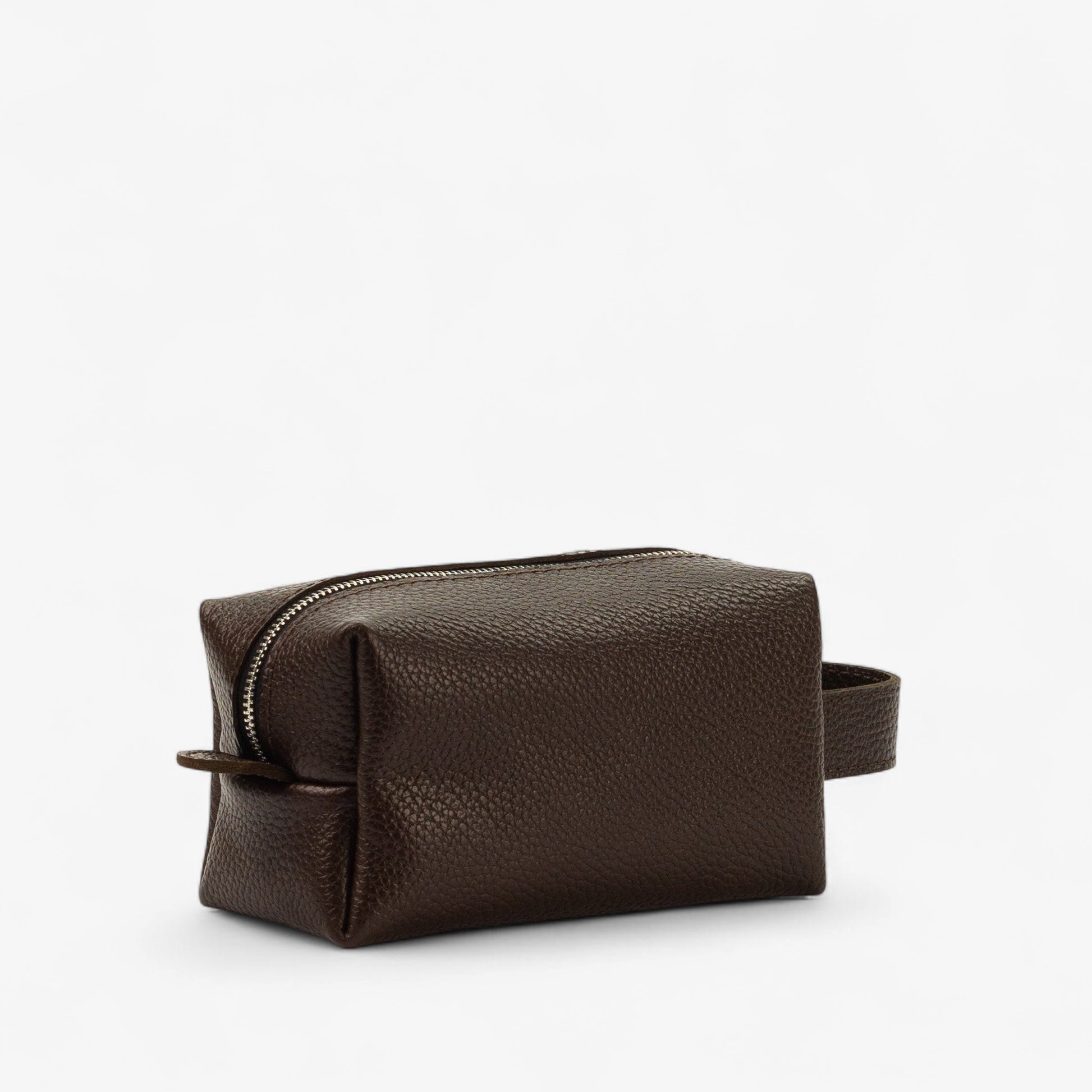 Brown leather toiletry bag on a white background