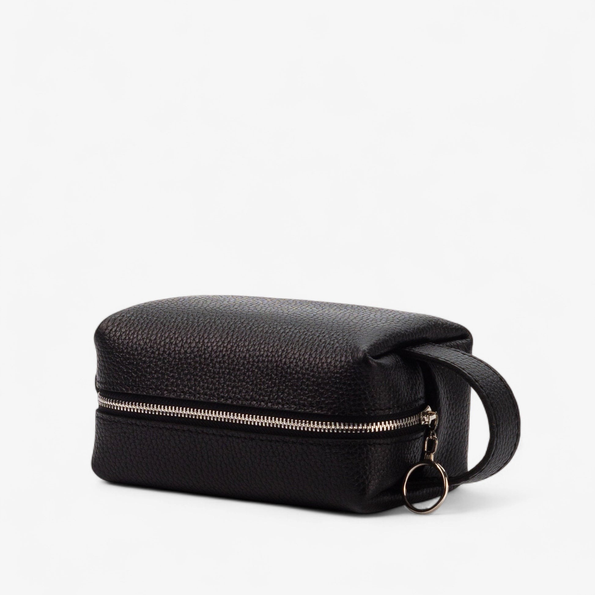 Black leather toiletry bag with a zipper on a white background
