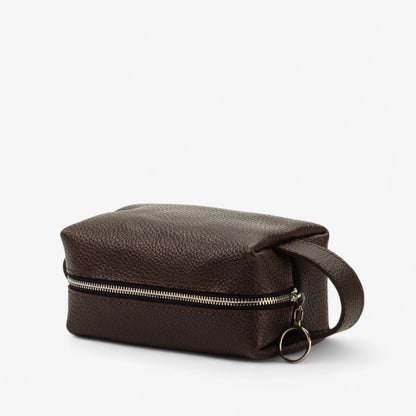 Brown leather bag with a zipper on a white background