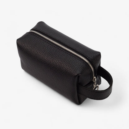 Black leather toiletry bag with a zipper on a white background