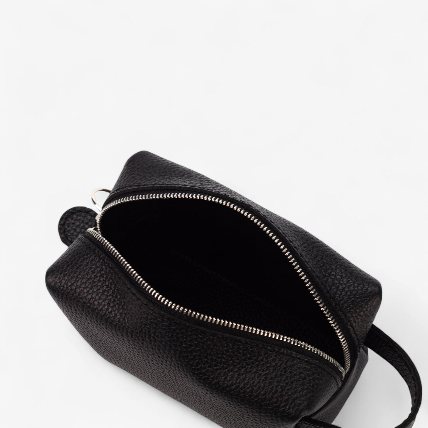 Black leather bag with zipper on a white background