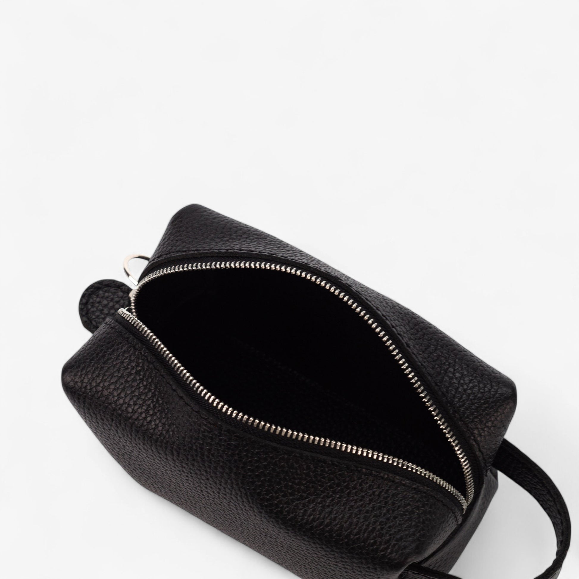 Black leather bag with zipper on a white background