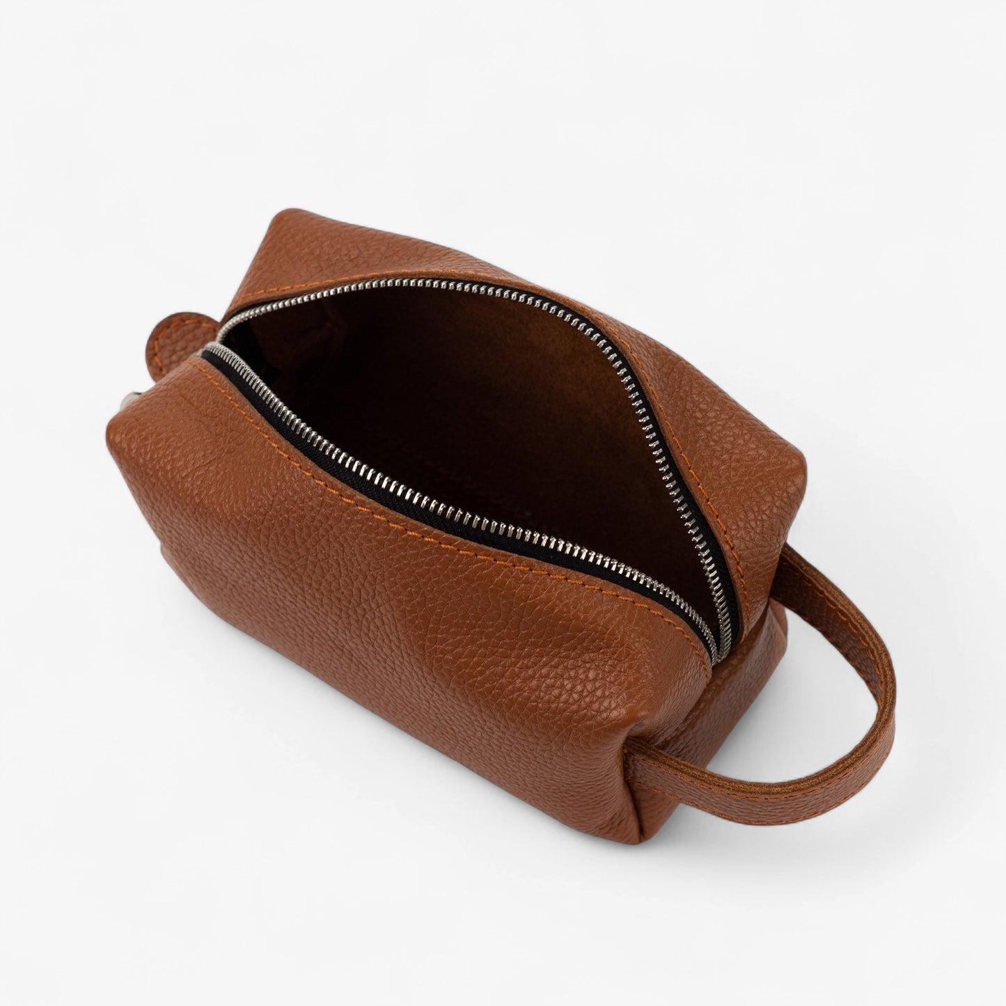 Brown leather bag with a zipper on a white background