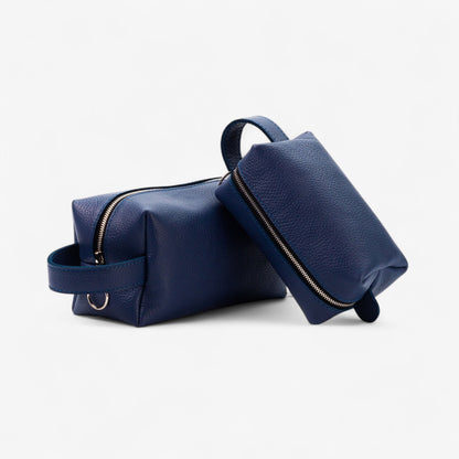 Two navy blue leather bags on a white background