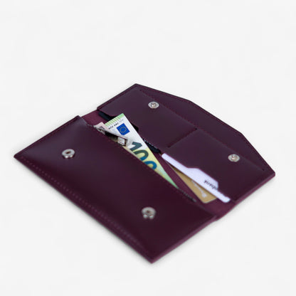 Open burgundy leather wallet filled with cards and cash, compact everyday design