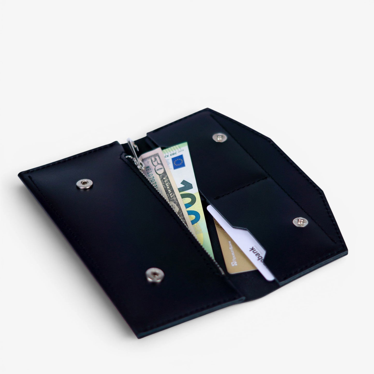 Open black leather wallet filled with cards and cash, compact everyday design