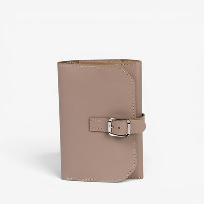 Gray Elin jewelry roll closed with leather buckle strap