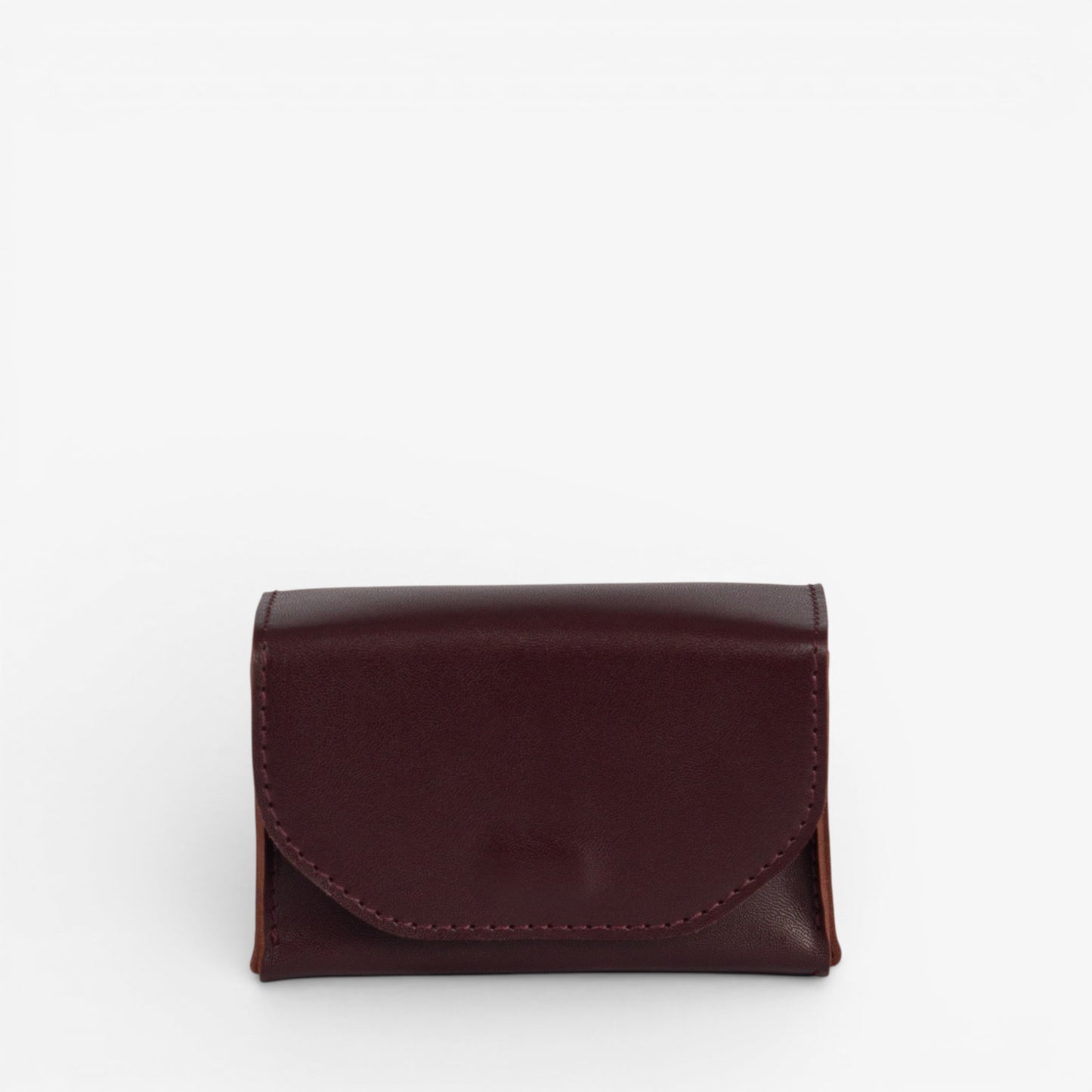 Burgundy Arcana tarot deck case closed with structured leather shape and hidden magnetic closure