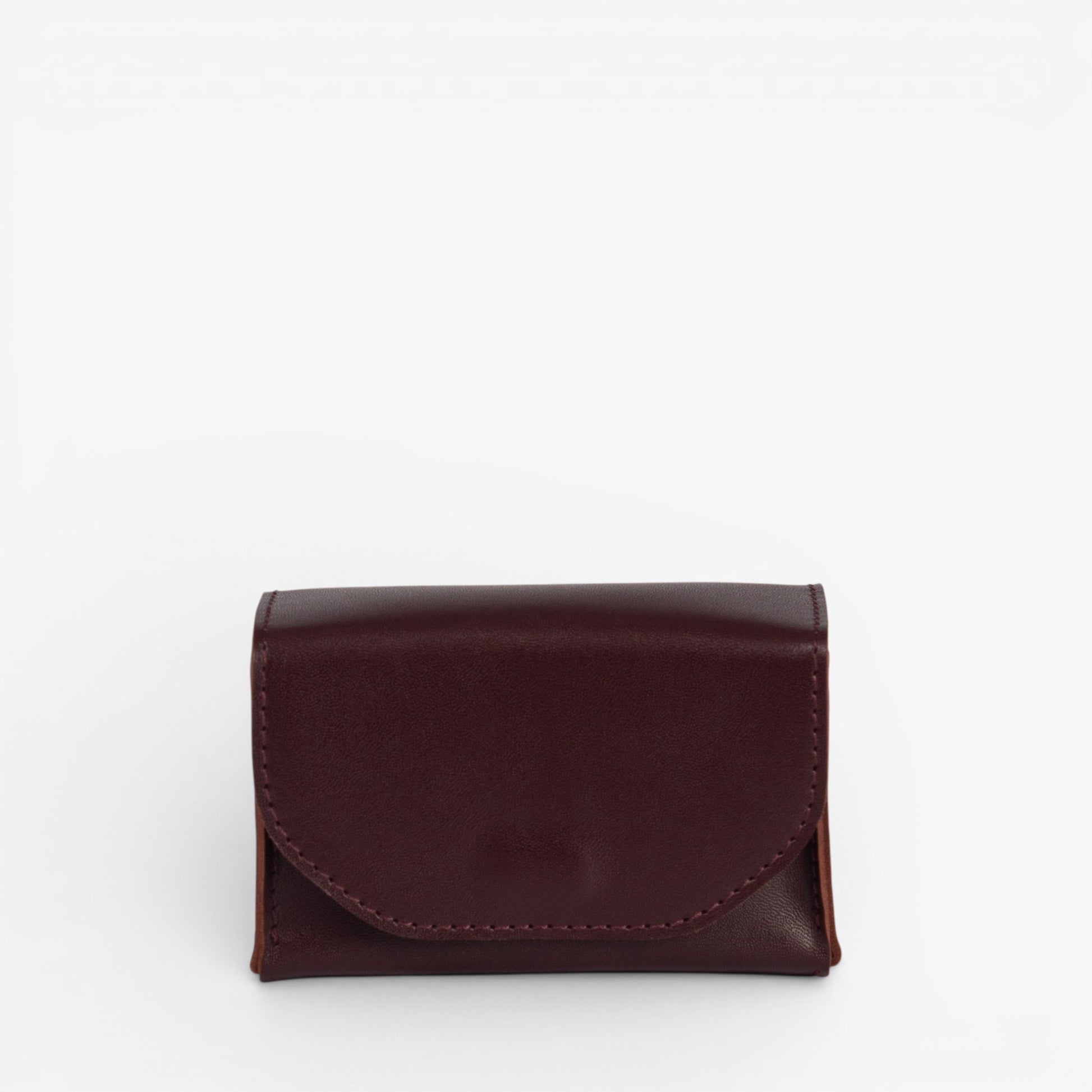 Burgundy Arcana tarot deck case closed with structured leather shape and hidden magnetic closure