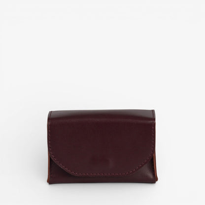 Burgundy Arcana tarot deck case closed with structured leather shape and hidden magnetic closure