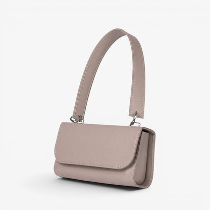 Gray leather handmade handbag with a shoulder strap on a white background
