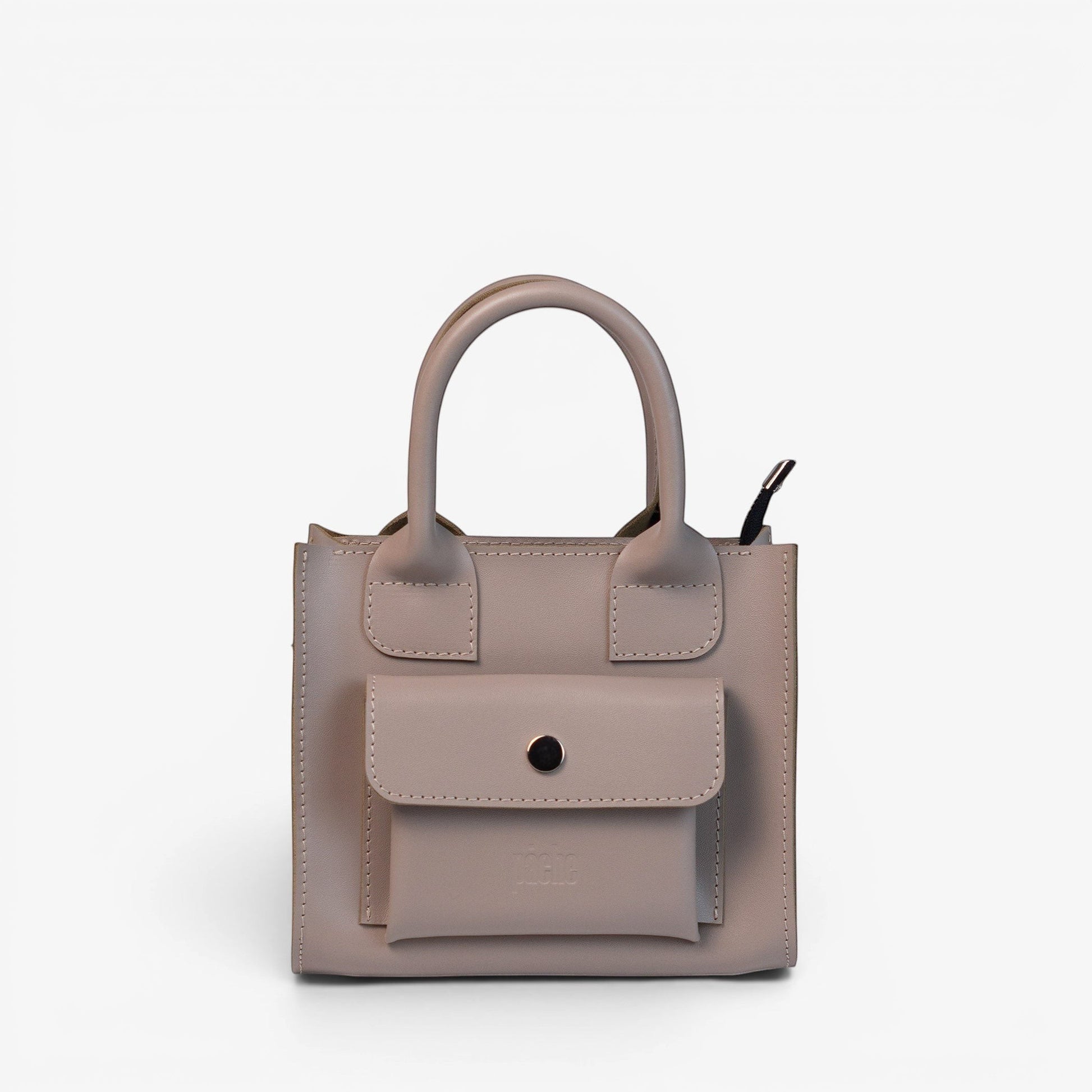 Pache gray smooth leather mini tote bag with a structured shape and front pocket. Adjustable strap for crossbody, shoulder, or hand carry.